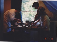 Roxanne and I in the kitchen putting out the early dinner party at our San Bruno house