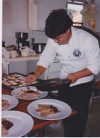 Roxanne and I in the kitchen putting out the early dinner party at our San Bruno house