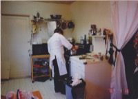 Roxanne and I in the kitchen putting out the early dinner party at our San Bruno house