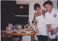 Roxanne and I in the kitchen putting out the early dinner party at our San Bruno house