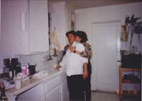 Roxanne and I in the kitchen putting out the early dinner party at our San Bruno house