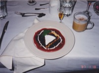 Hazelnut tart  with raspberry and chocolate sauce,thats a fairly nice little plate
